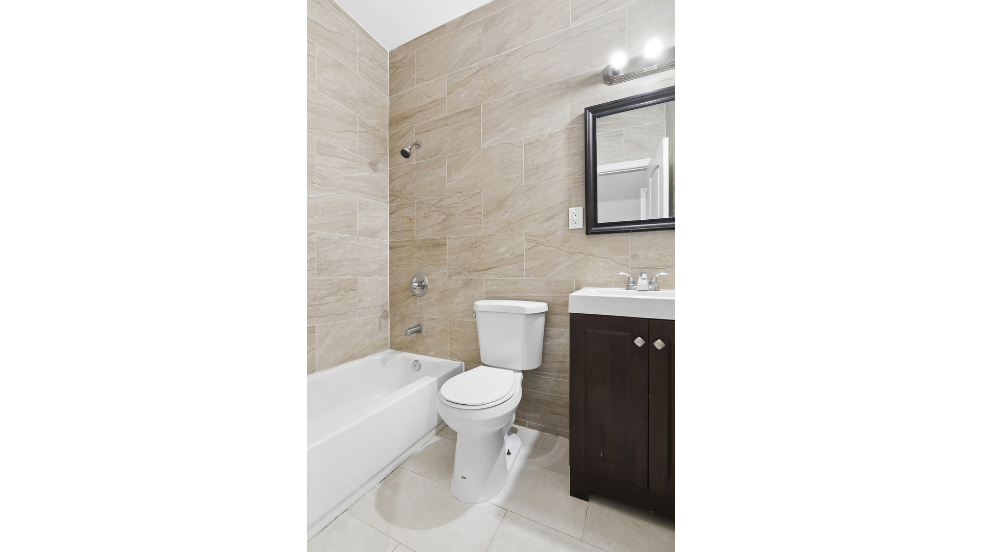 2001 Strauss Street, Unit 2 Brooklyn, NY 11212 - Photo 5 of 6 a bathroom with a toilet and a sink