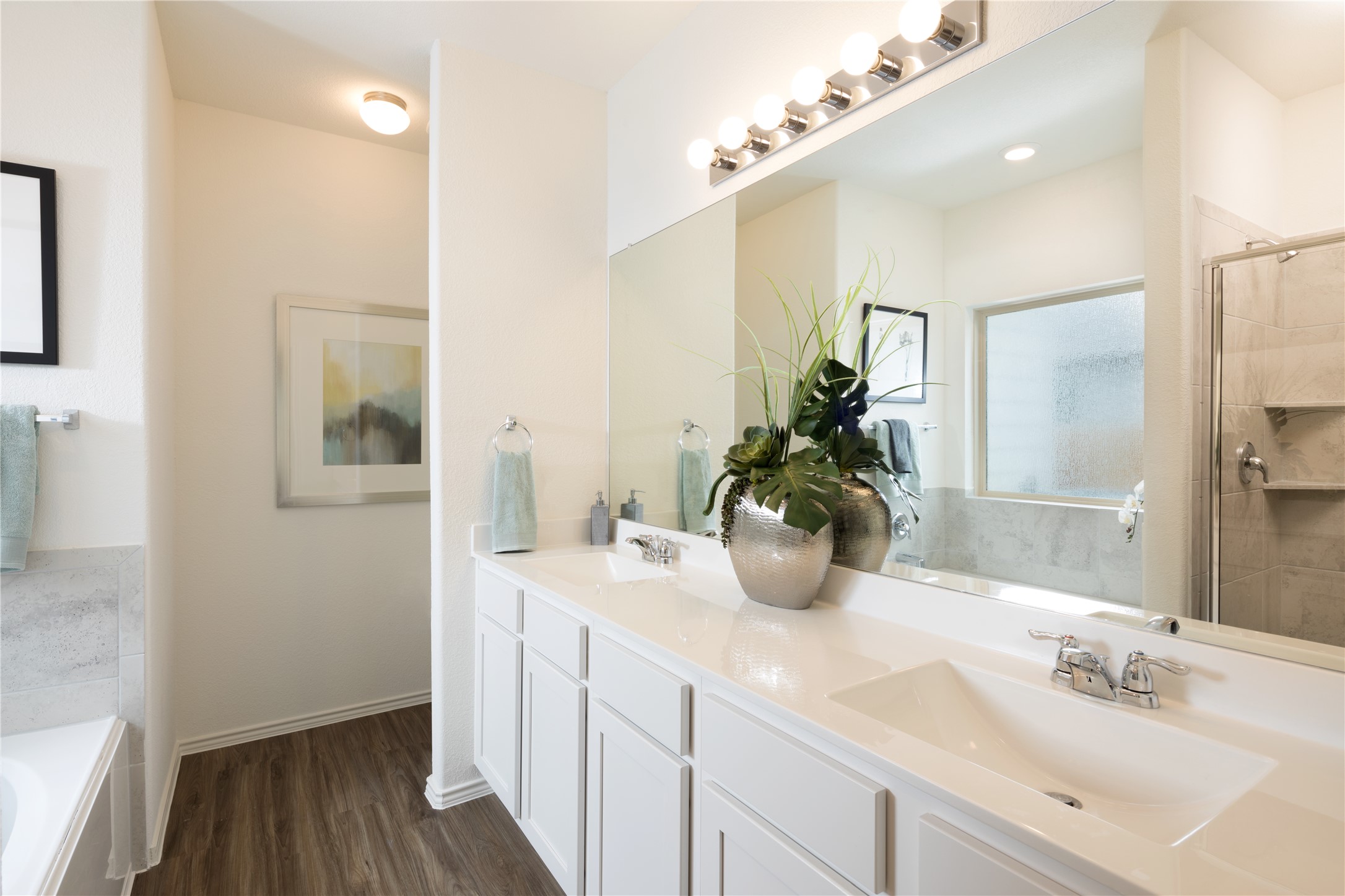 17910 Nashville Warbler Road Pflugerville, TX 78660 - Photo 15 of 17 a bathroom with a double vanity sink and a mirror