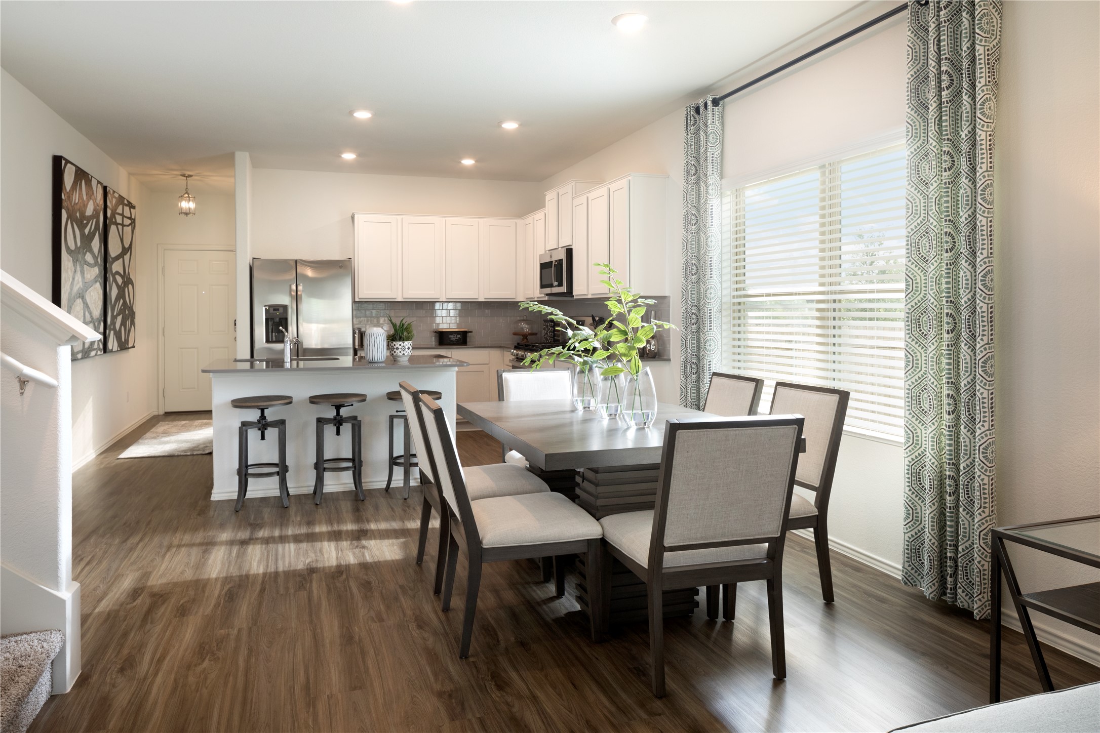 17910 Nashville Warbler Road Pflugerville, TX 78660 - Photo 8 of 17 a view of a dining room with furniture and wooden floor