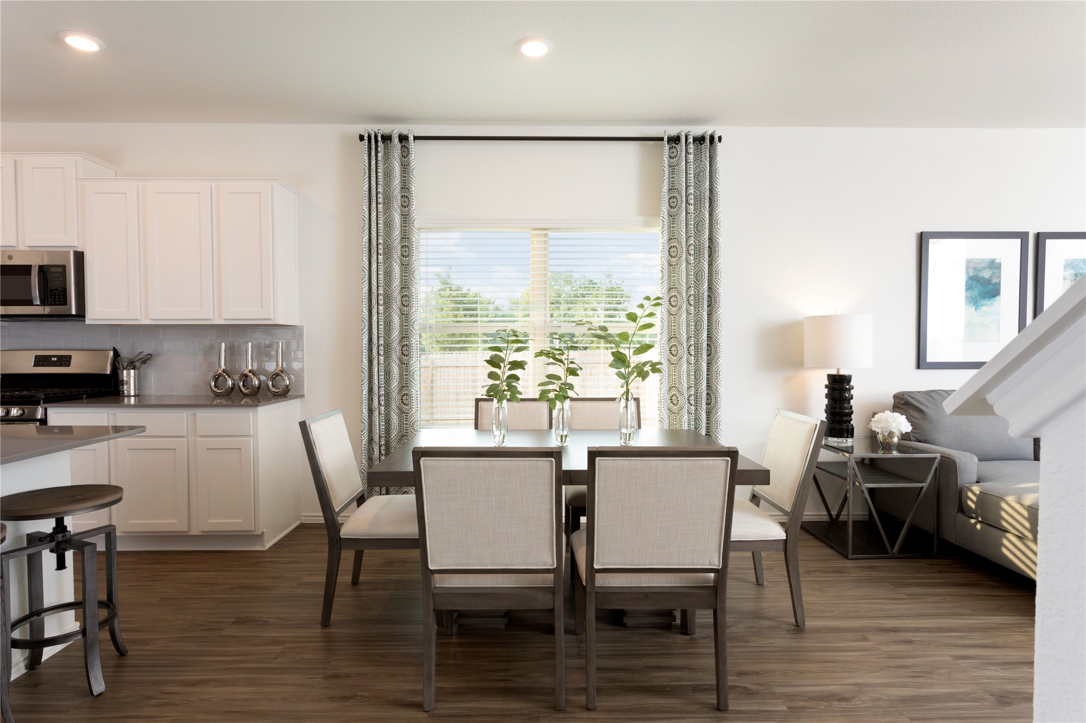 17910 Nashville Warbler Road Pflugerville, TX 78660 - Photo 9 of 17 a view of a dining room with furniture and wooden floor
