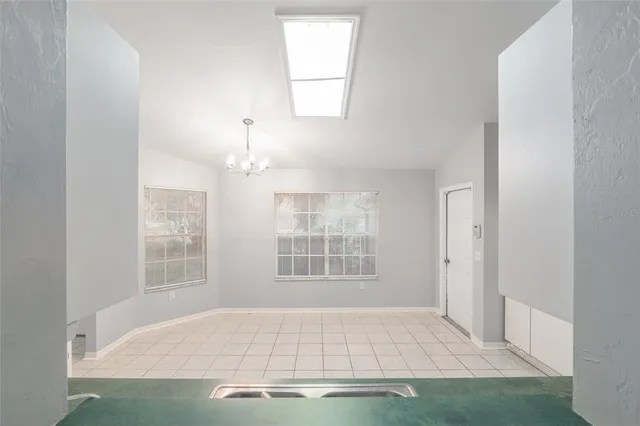 an empty room with windows and yard