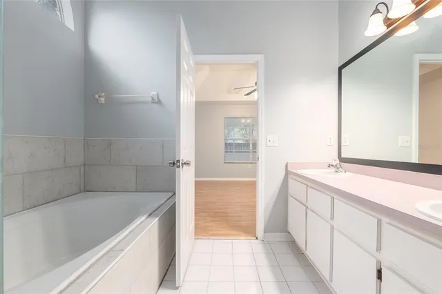 a bathroom with a bathtub and a sink