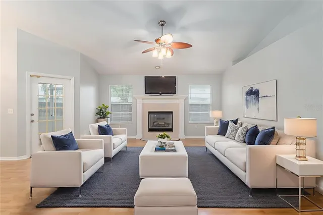 a living room with furniture and a fireplace