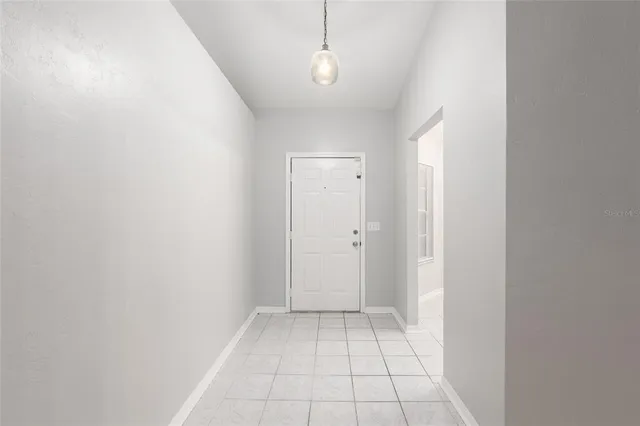 a view of an empty room and window