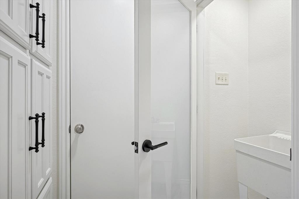 62 Legend Road Benbrook, TX 76132 - Photo 12 of 27 Off the kitchen is an additional storage space and sink.