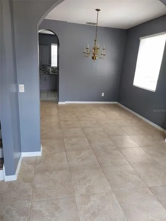 a kitchen with a stove top oven a sink a counter top space and cabinets