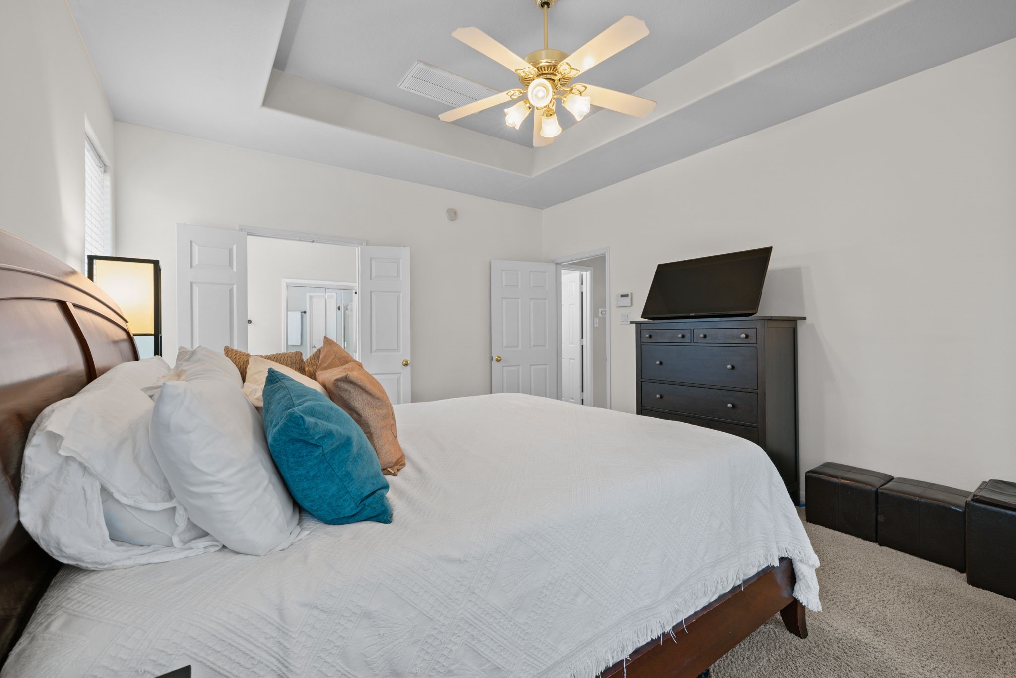 19114 Emory Trail Spring, TX 77388 - Photo 21 of 44 a bedroom with a bed and a chandelier