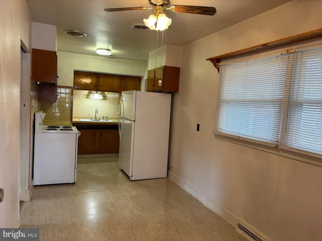 a view of a kitchen with a sink