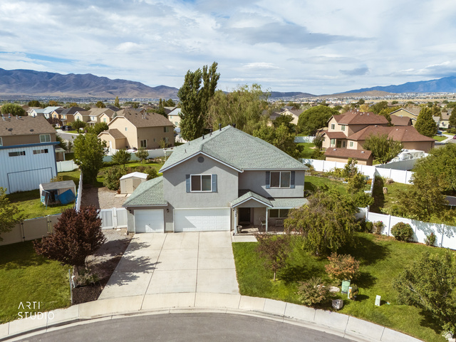 342 South Willow Patch Road Lehi, UT 84043 - Photo 28 of 30 Two-story residence with a light gray exterior and green roof shingles