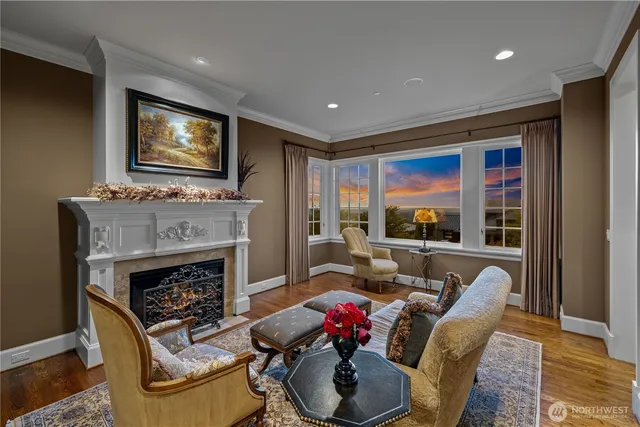 a living room with furniture fireplace and flat screen tv