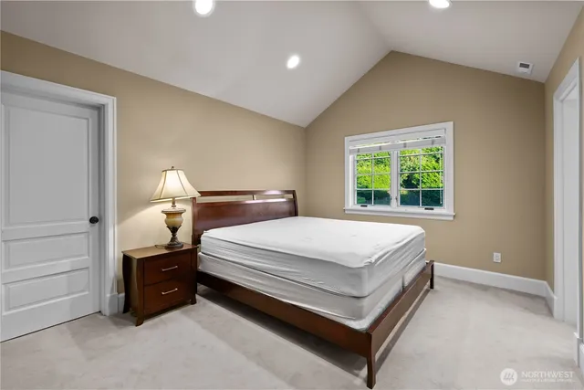 a bed room with a bed and window