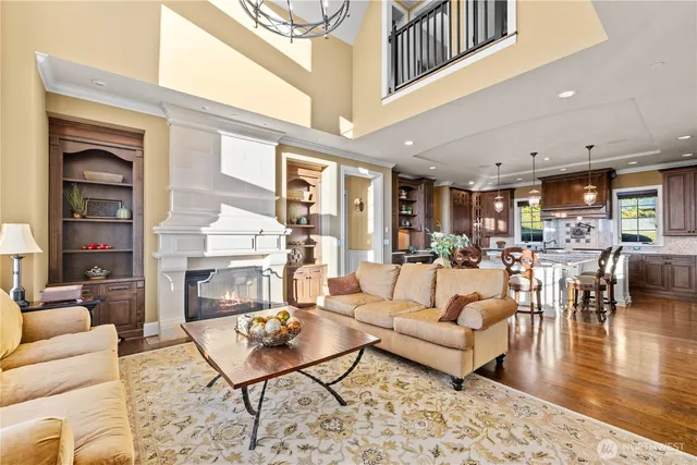 a living room with furniture dining table and a fireplace