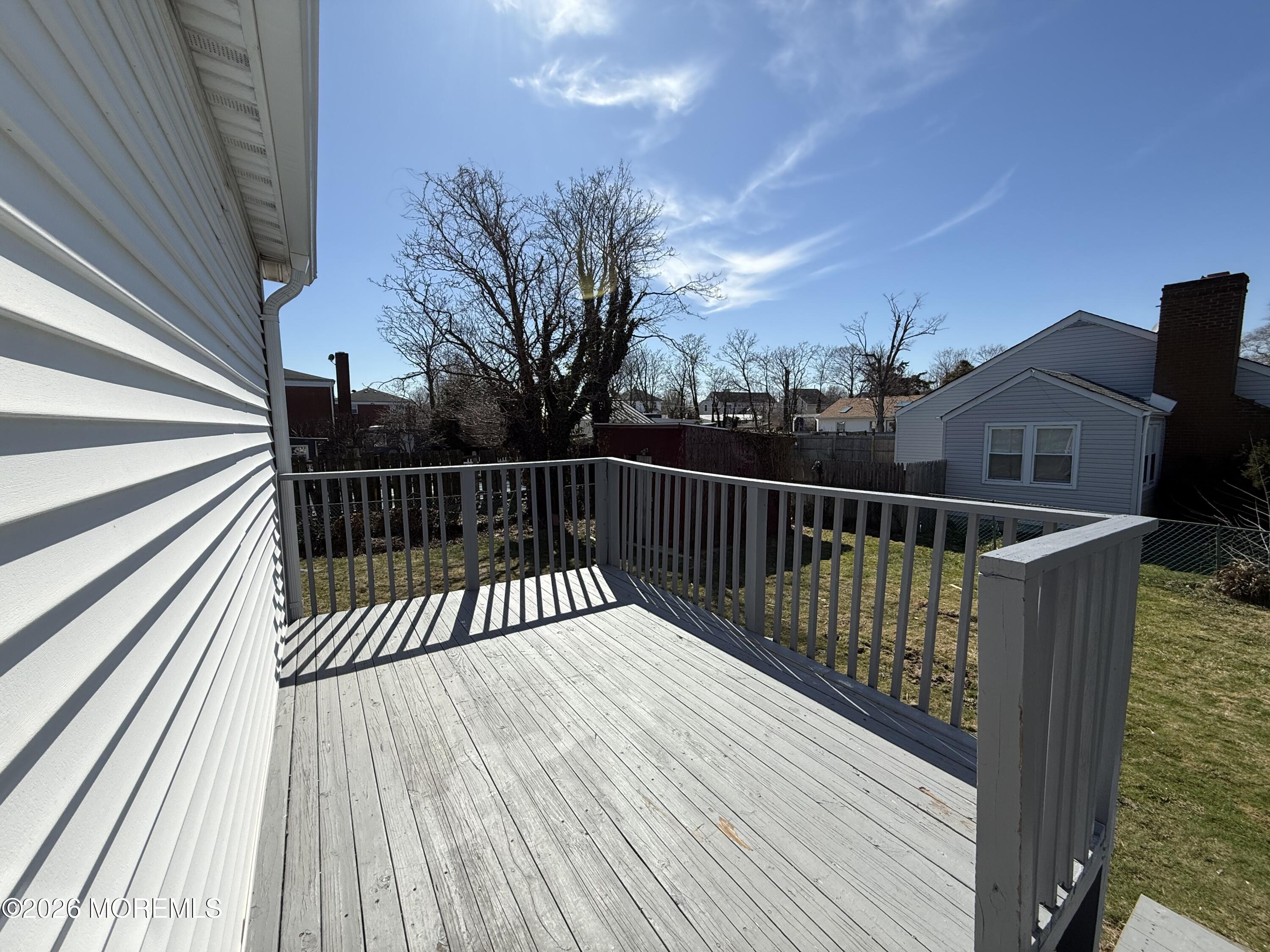 464 2nd Avenue, Unit 1 Long Branch, NJ 07740 - Photo 11 of 37 a view of balcony with wooden floor and fence