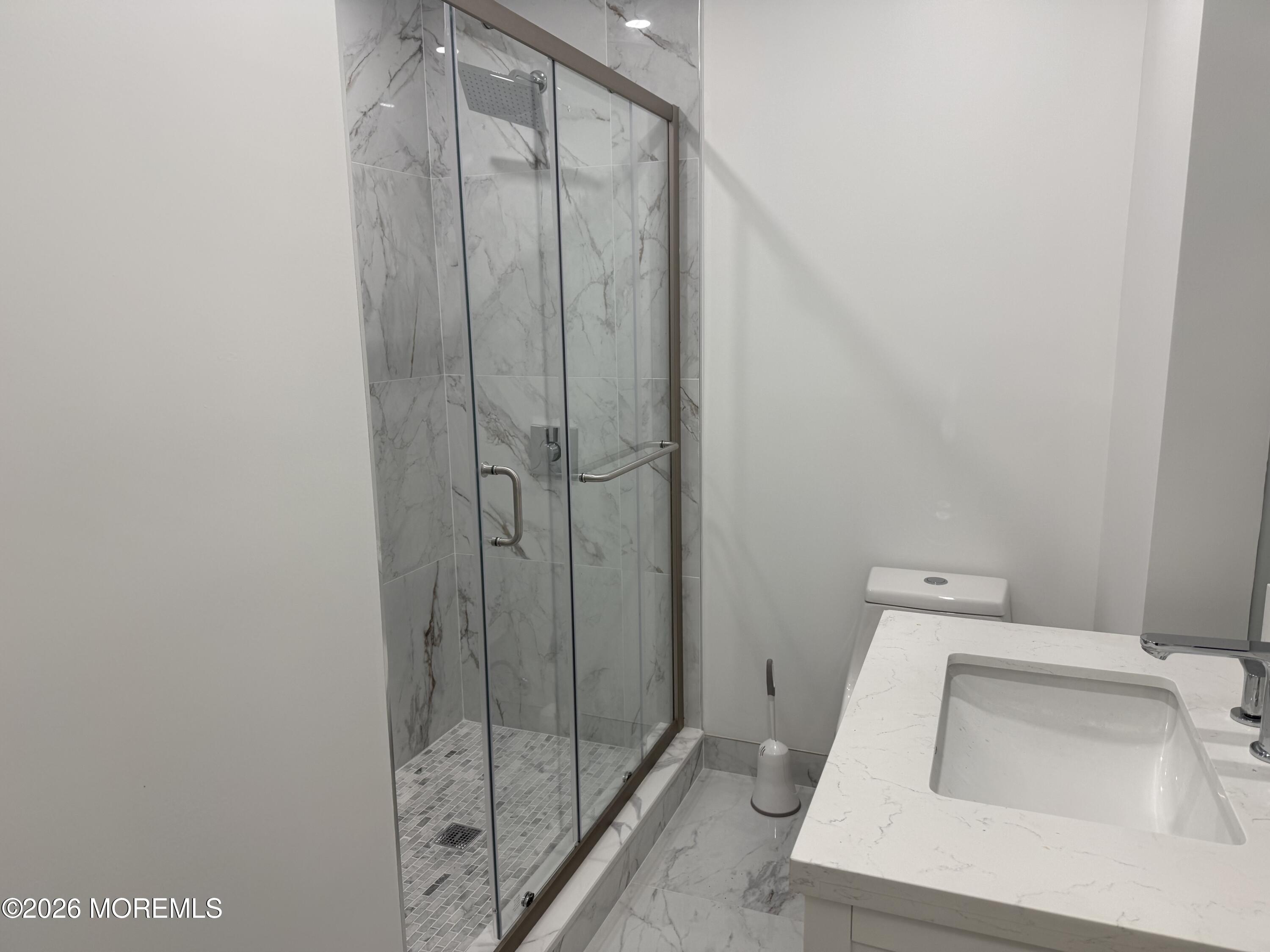 464 2nd Avenue, Unit 1 Long Branch, NJ 07740 - Photo 17 of 37 a bathroom with a sink and toilet