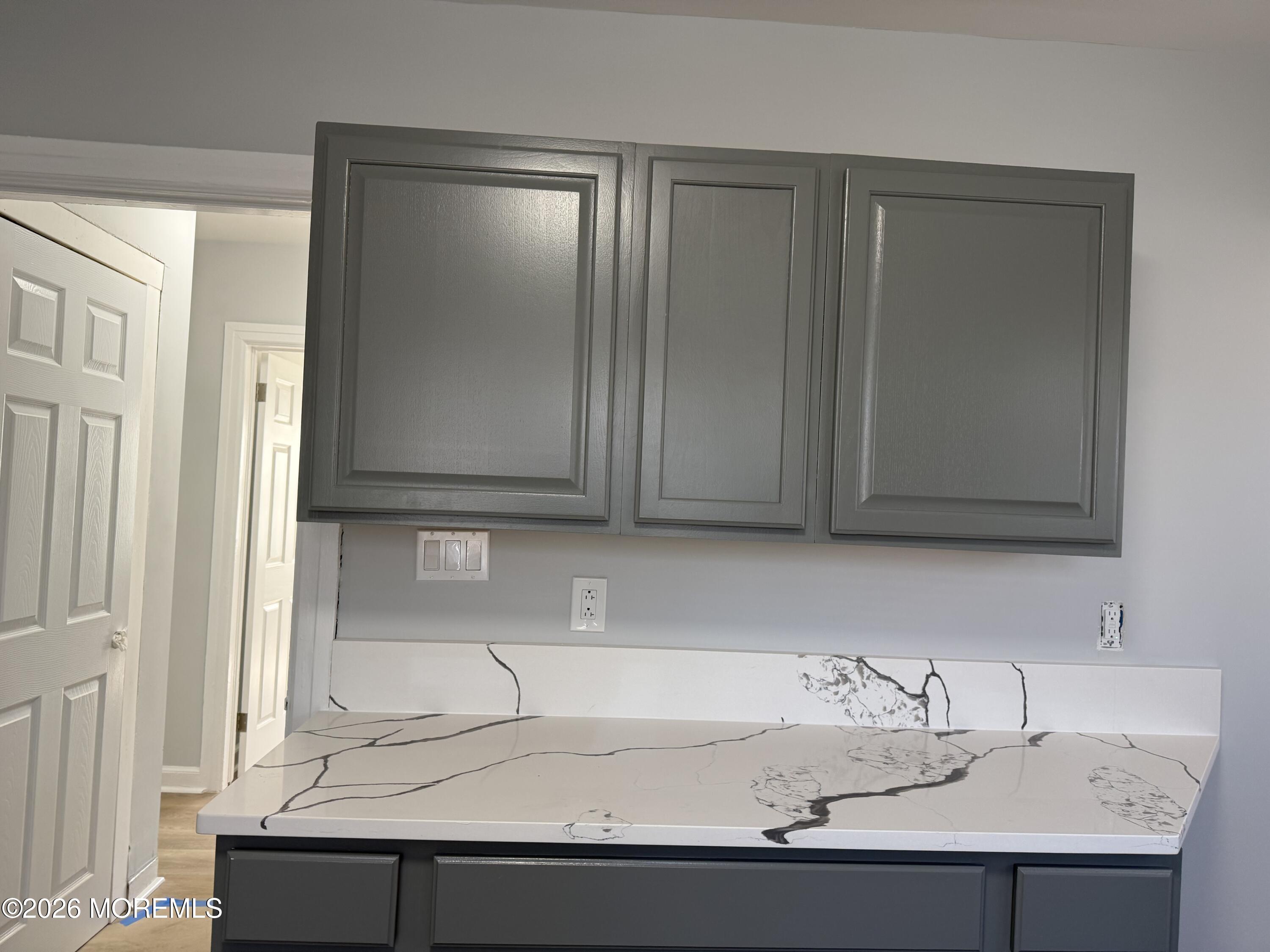 464 2nd Avenue, Unit 1 Long Branch, NJ 07740 - Photo 23 of 37 a bathroom with a sink and a mirror