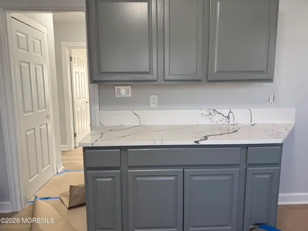 a view of a hallway with washer and dryer