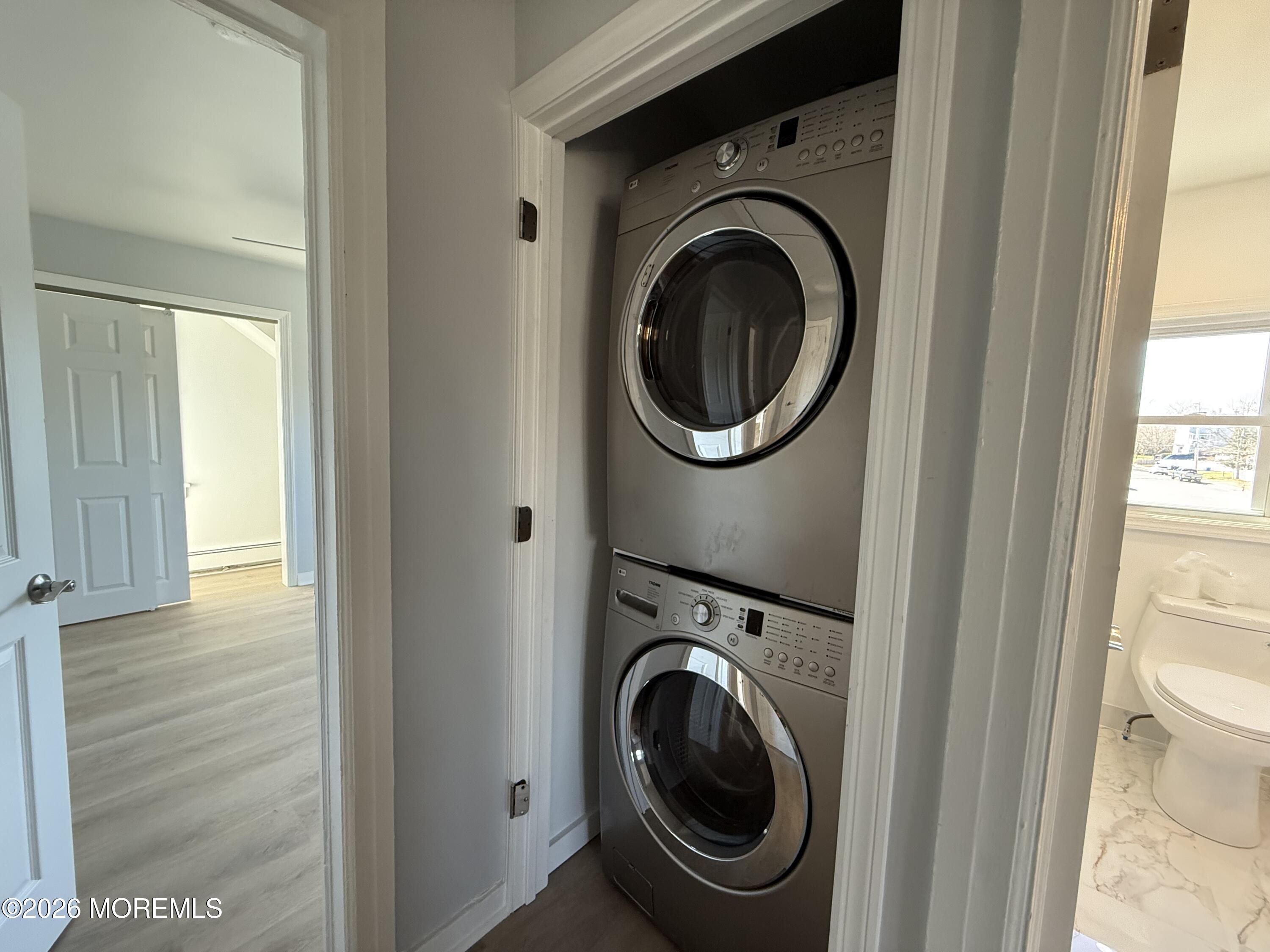 464 2nd Avenue, Unit 1 Long Branch, NJ 07740 - Photo 27 of 37 a view of a hallway with washer and dryer