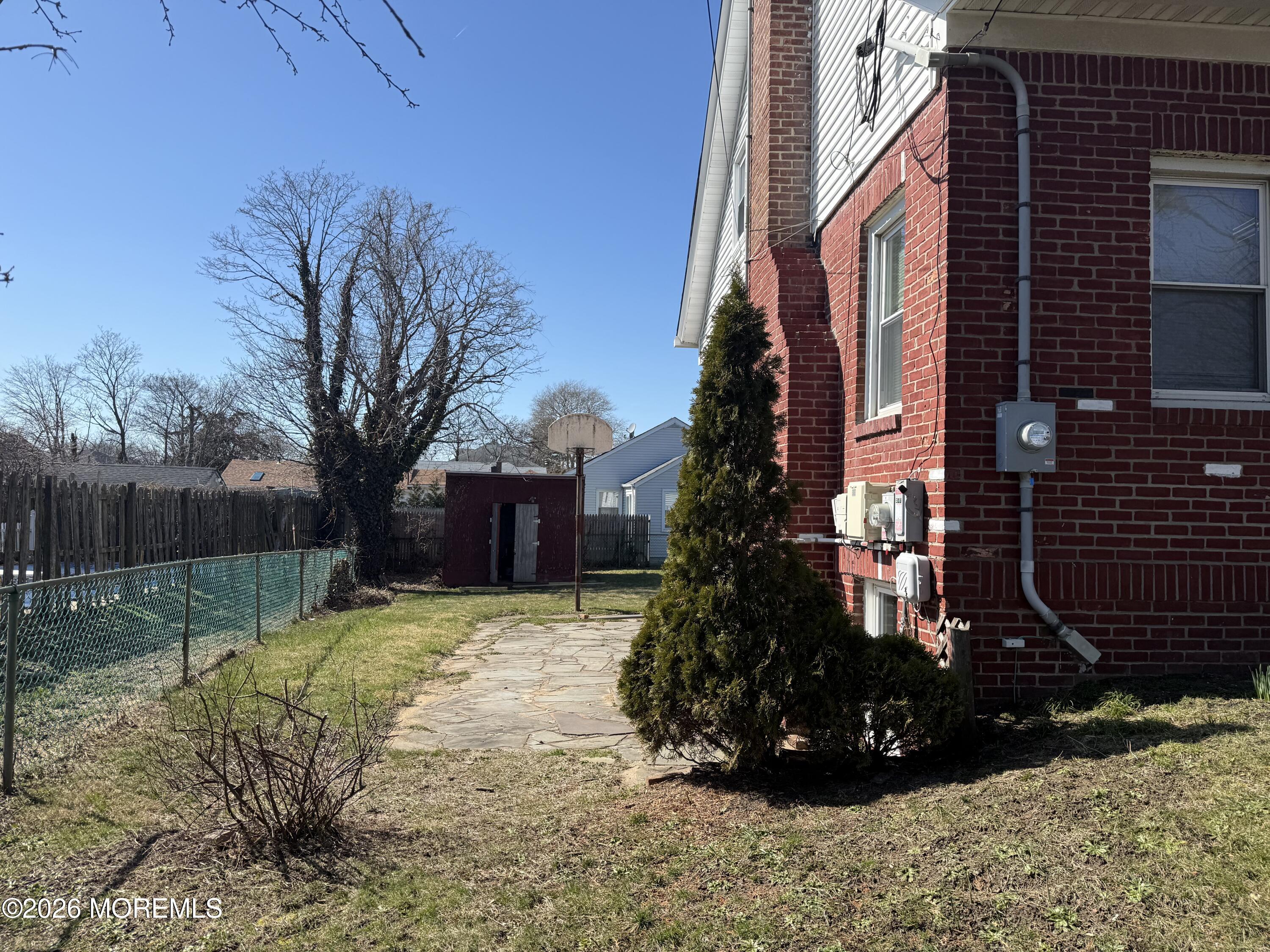 464 2nd Avenue, Unit 1 Long Branch, NJ 07740 - Photo 4 of 37 a view of a yard with a house and tree s