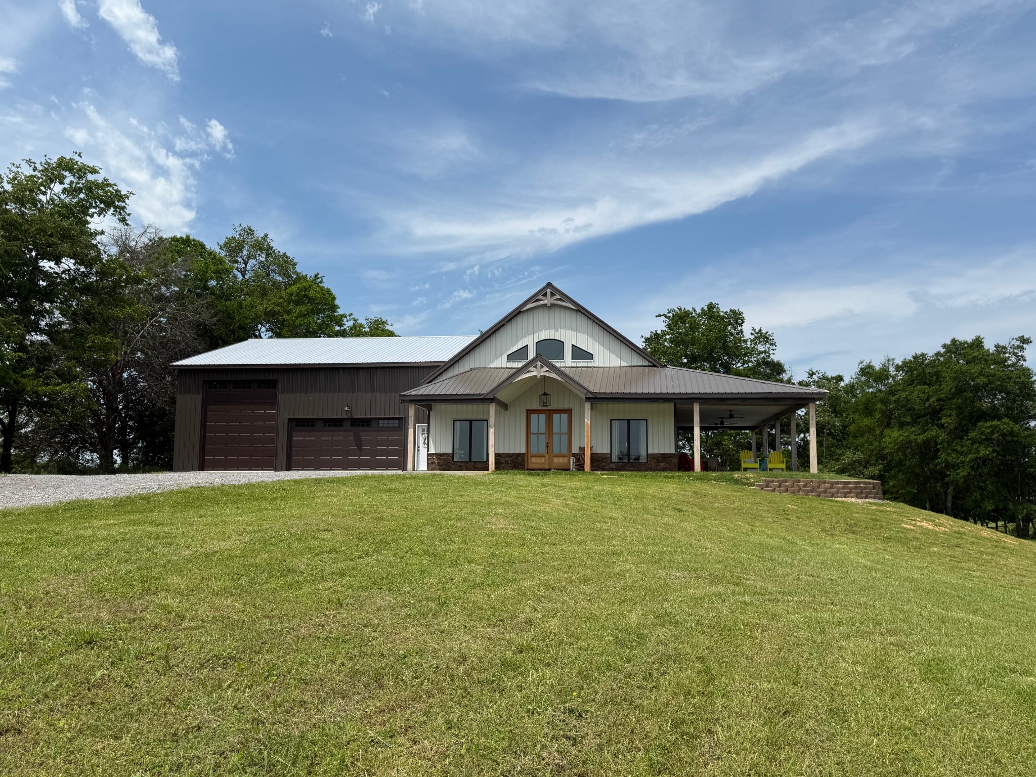 a front view of a house with a garden