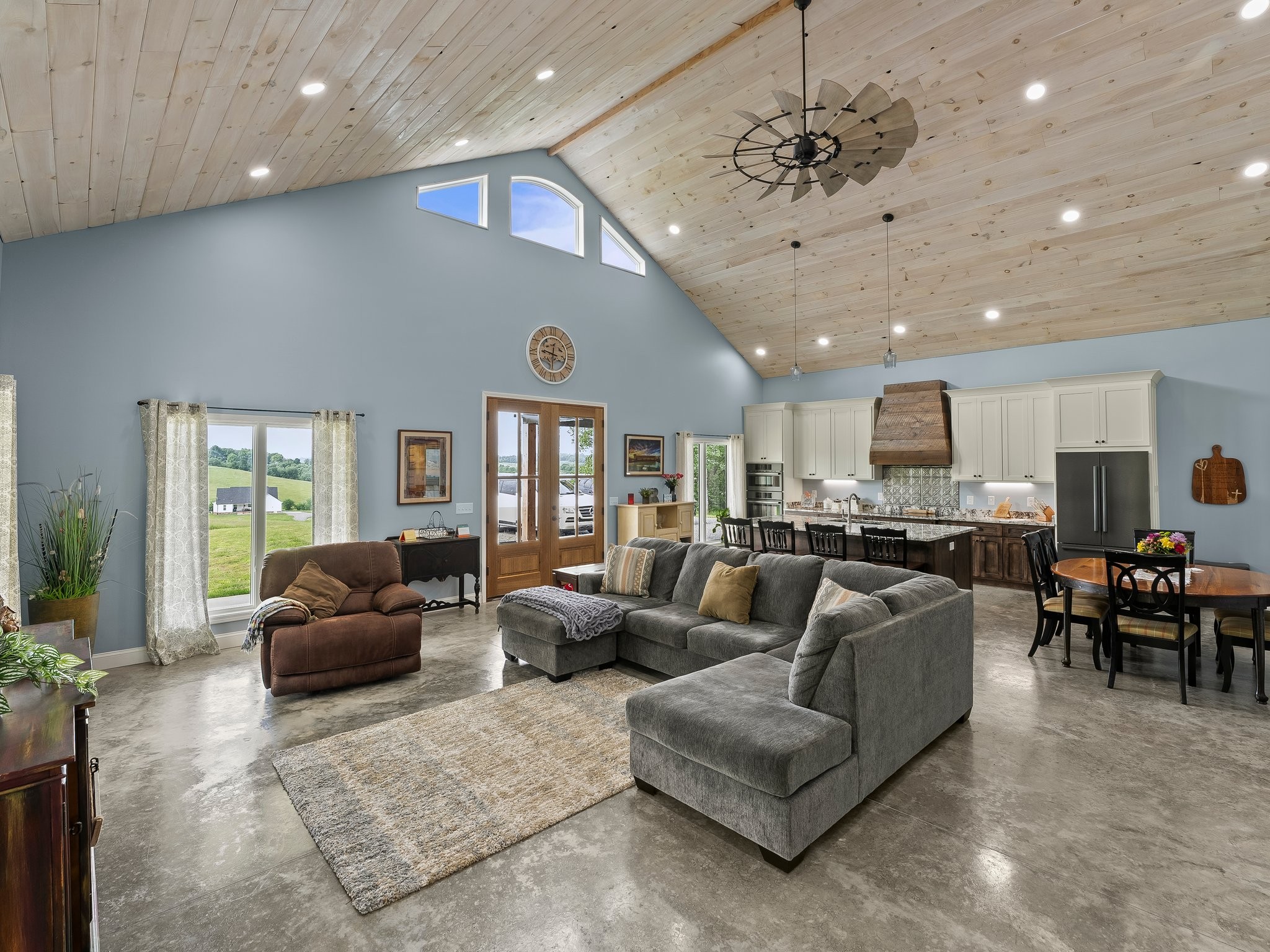 757 Thompson Creek Road Wartrace, TN 37183 - Photo 16 of 42 a living room with furniture ceiling fan and a large window