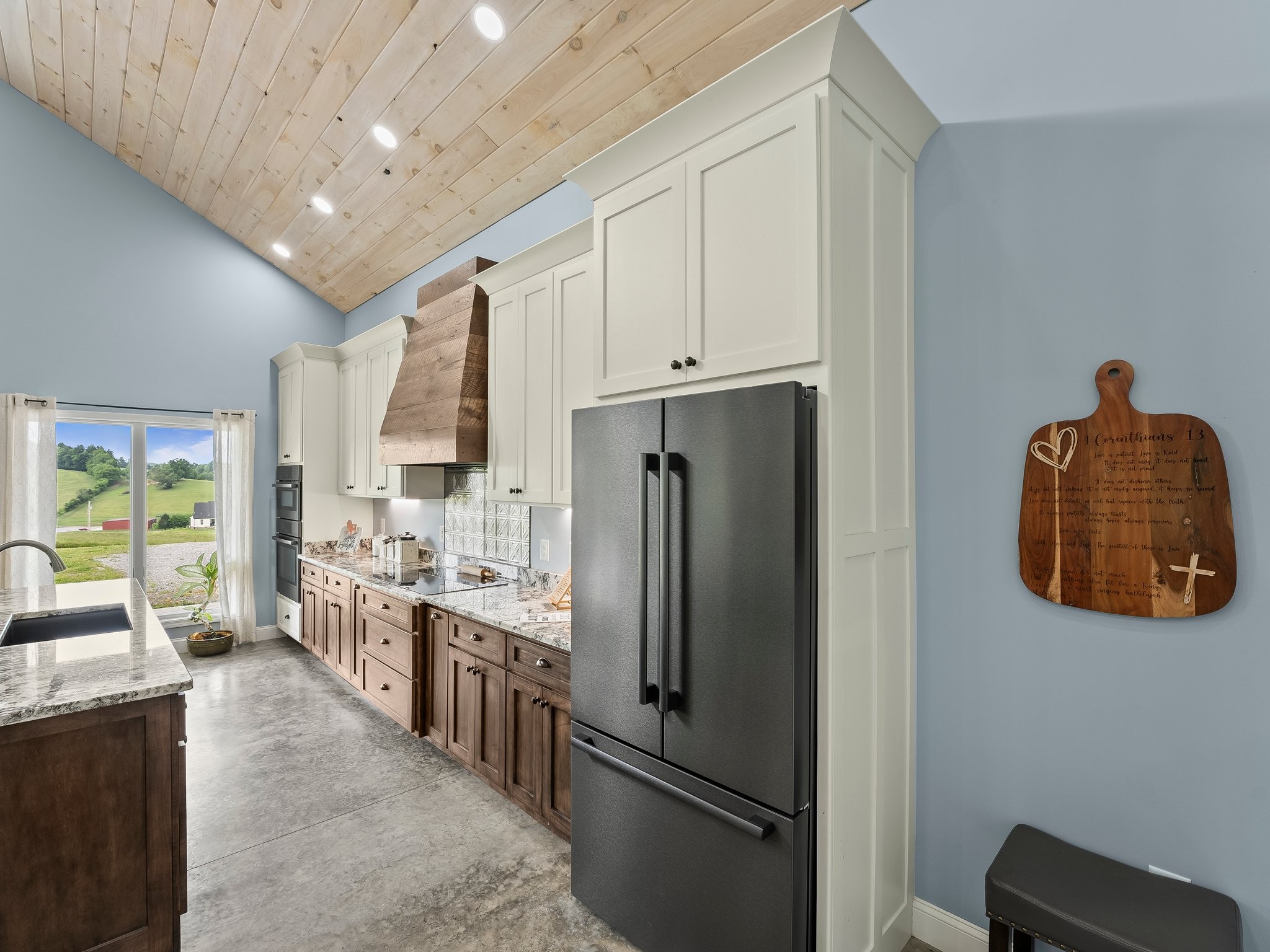 757 Thompson Creek Road Wartrace, TN 37183 - Photo 23 of 42 a kitchen with stainless steel appliances a refrigerator sink and cabinets