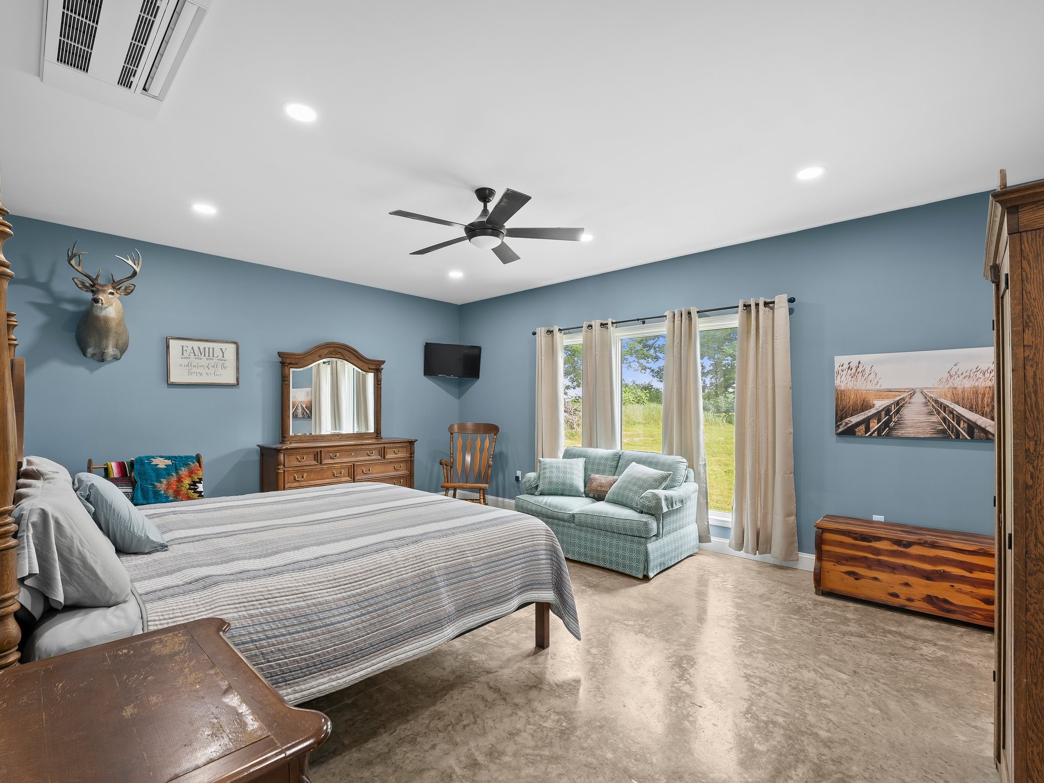 757 Thompson Creek Road Wartrace, TN 37183 - Photo 26 of 42 a bedroom with a bed a couch and a window with outer view