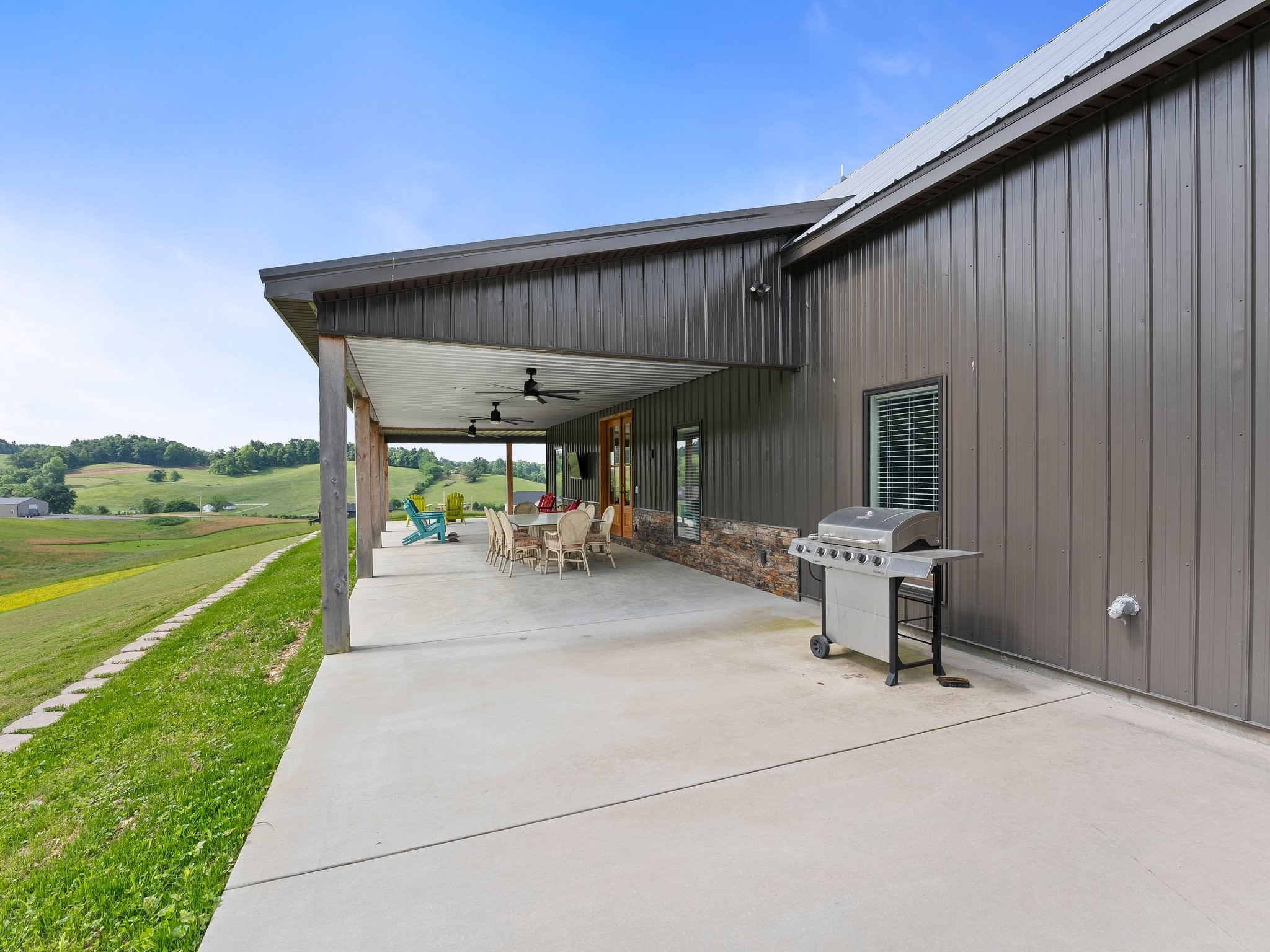 757 Thompson Creek Road Wartrace, TN 37183 - Photo 42 of 42 a view of a patio with table and chairs near a yard