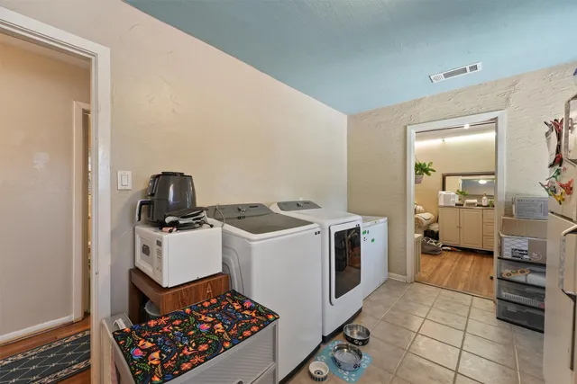 a kitchen with a sink stove and refrigerator