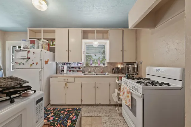 a view of a hallway with a white walls