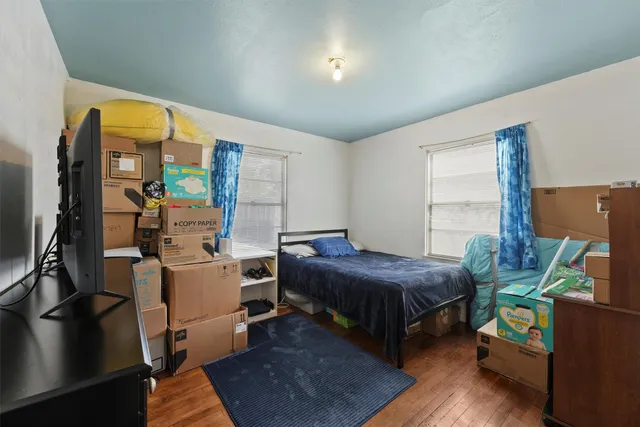 a bedroom with a bed furniture and a window