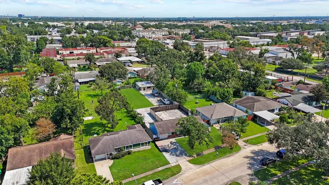 an aerial view of a city with lots of residential buildings