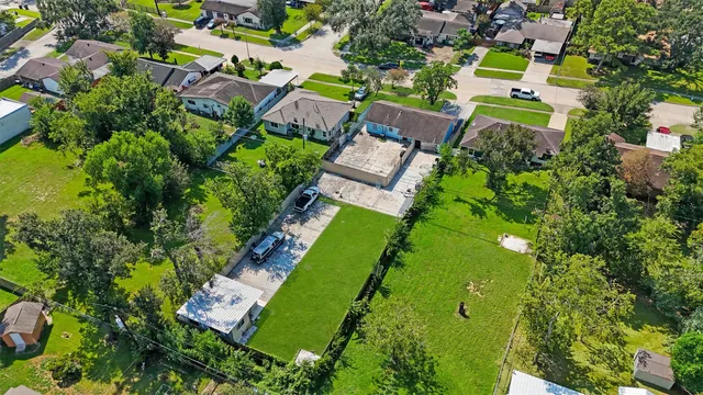 an aerial view of a house with a garden