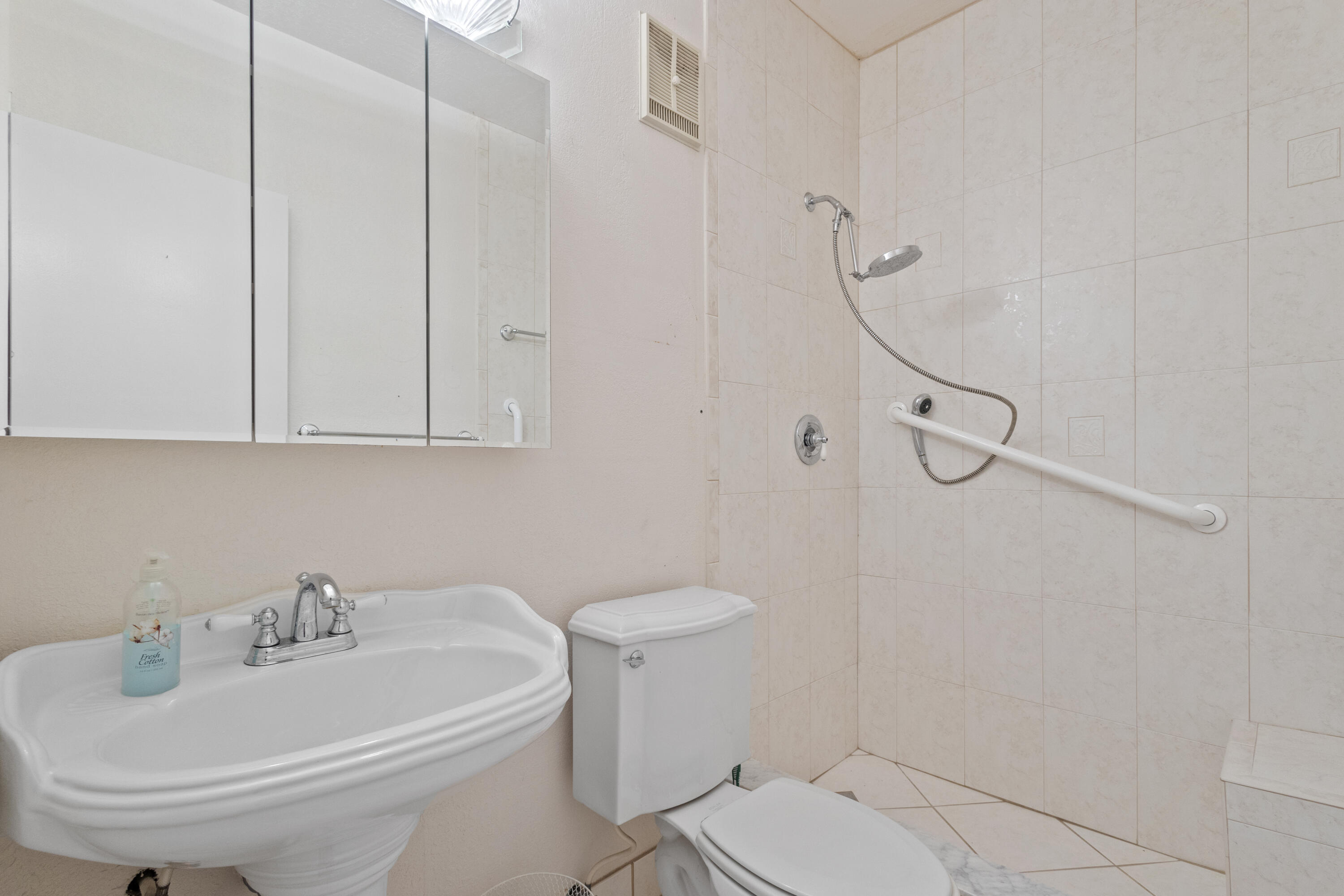 13528 Southwest 9th Lane Miami, FL 33184 - Photo 15 of 24 a bathroom with a sink a toilet and shower