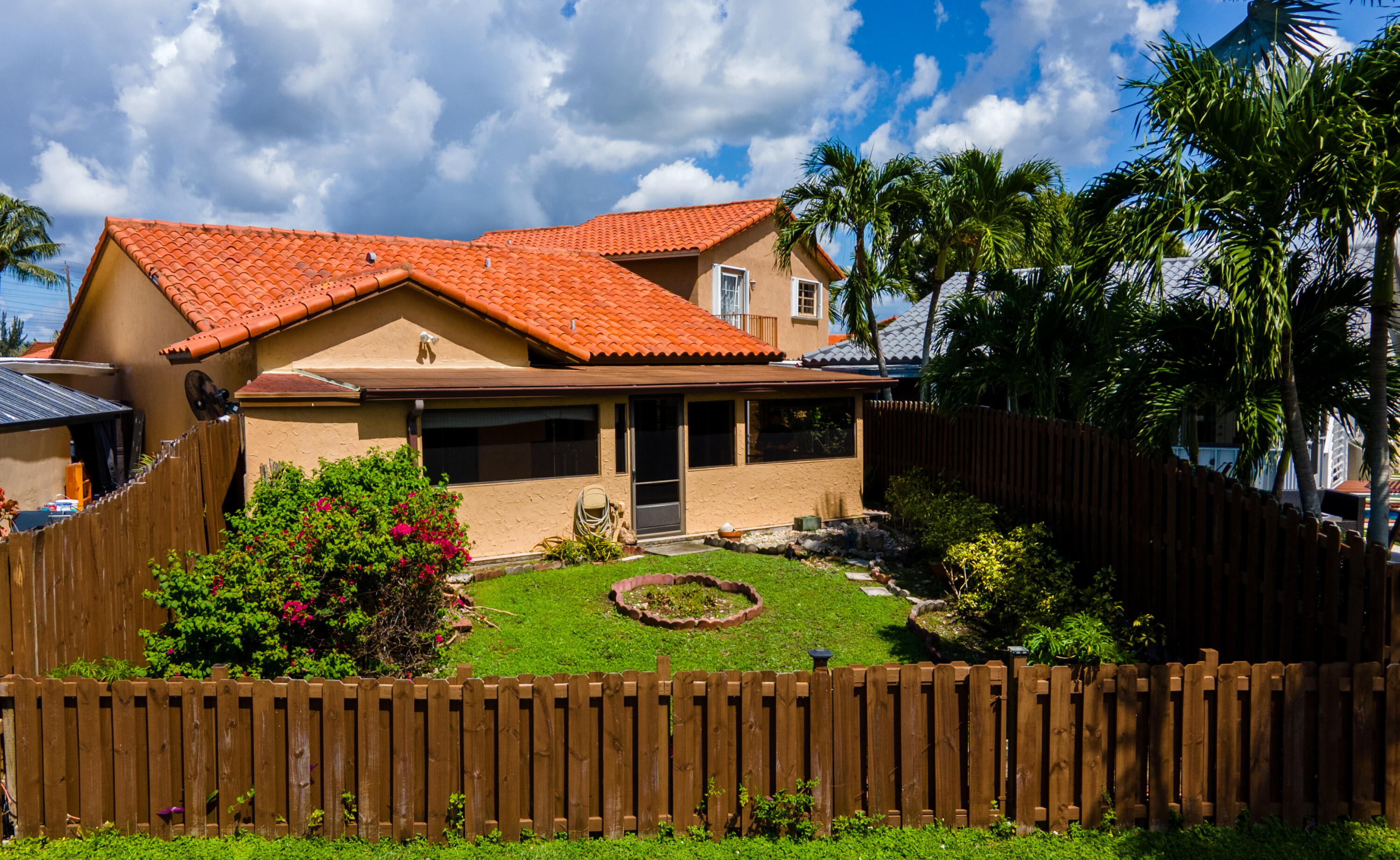 13528 Southwest 9th Lane Miami, FL 33184 - Photo 21 of 24 a view of house with wooden fence and garden