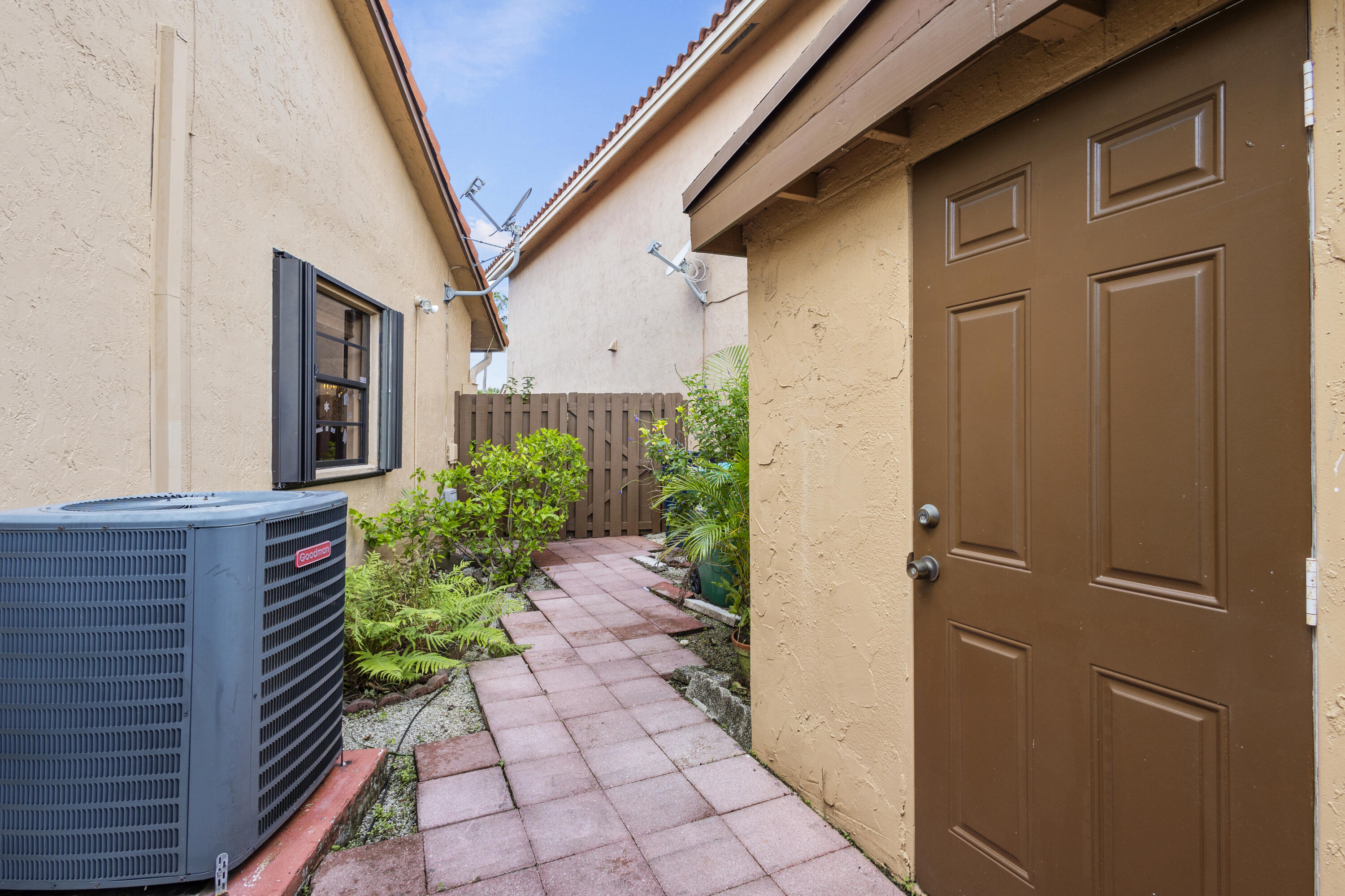 13528 Southwest 9th Lane Miami, FL 33184 - Photo 5 of 24 a view of a pathway along the building