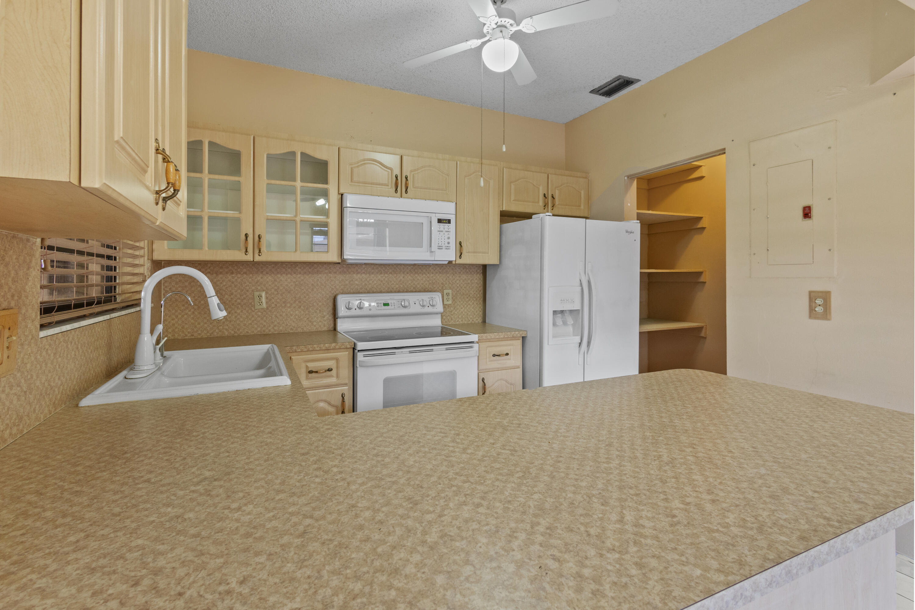 13528 Southwest 9th Lane Miami, FL 33184 - Photo 7 of 24 a kitchen with stainless steel appliances a refrigerator and a stove