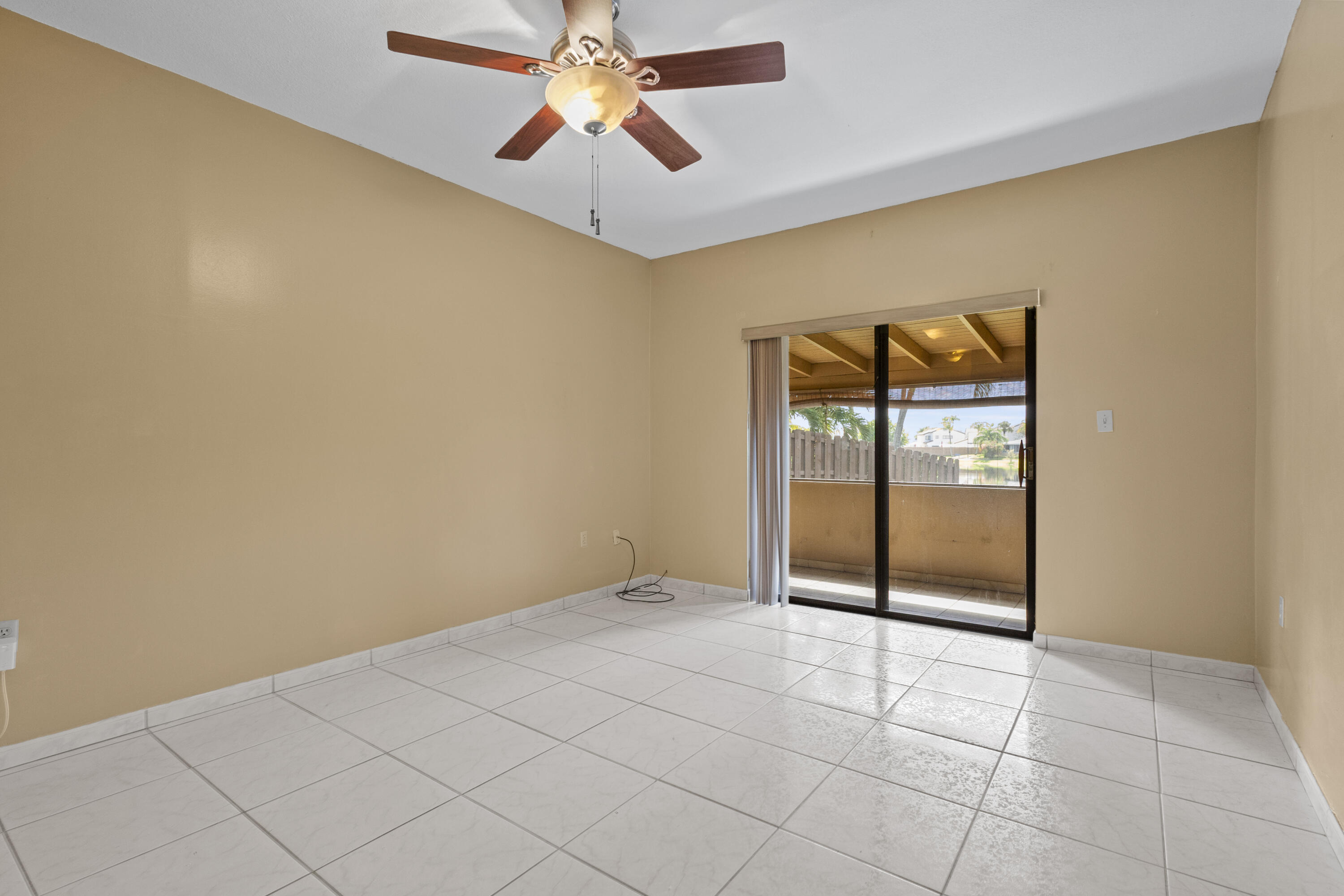 13528 Southwest 9th Lane Miami, FL 33184 - Photo 8 of 24 an empty room with windows and fan