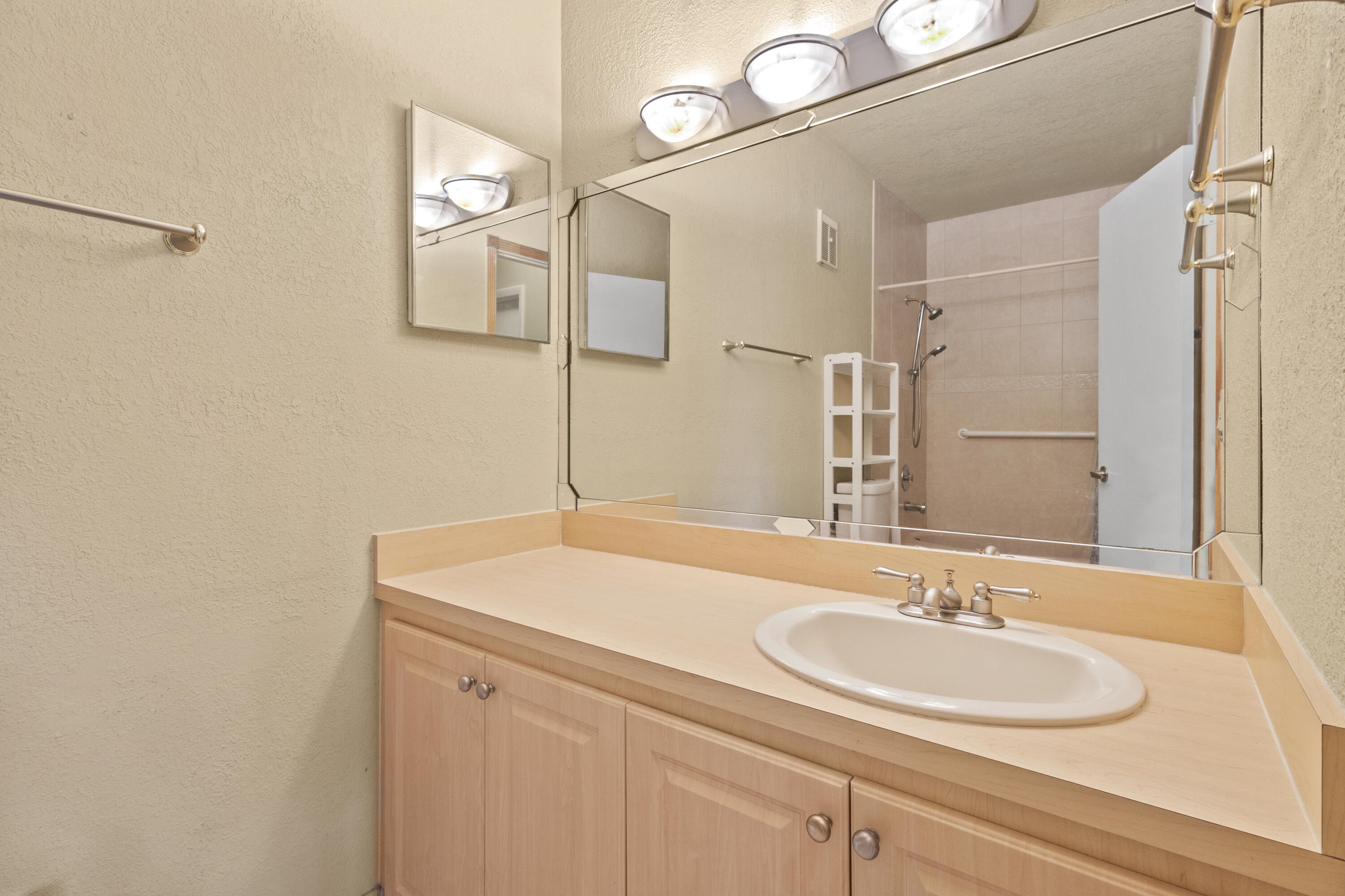 13528 Southwest 9th Lane Miami, FL 33184 - Photo 10 of 24 a bathroom with a sink and a mirror