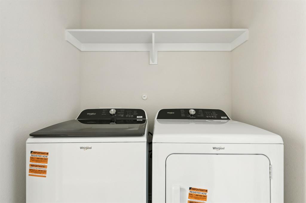 317 Clematis Street Princeton, TX 75407 - Photo 34 of 38 Laundry area with washer and clothes dryer