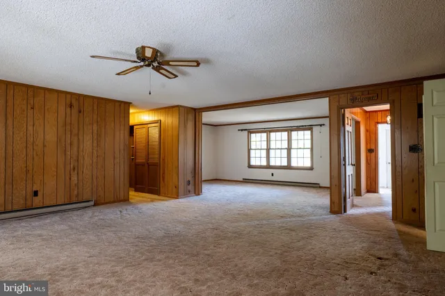 a view of empty room with windows