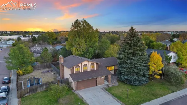 an aerial view of a house with a garden