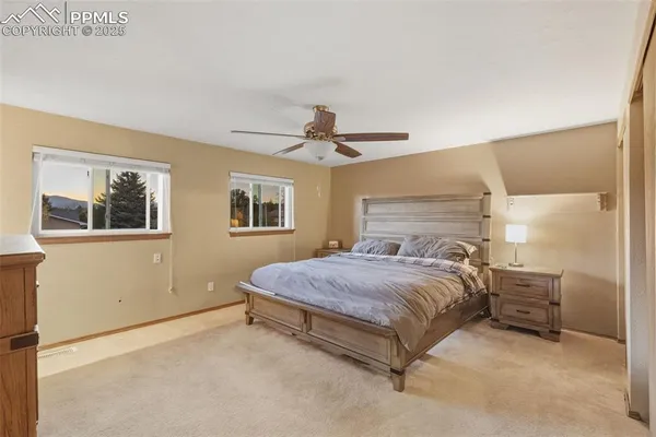 a bedroom with a bed dresser and a window
