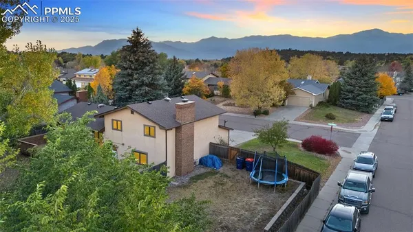 a view of a house with a mountain in the background