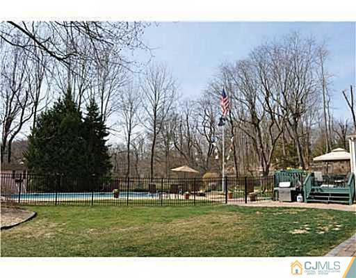152 Mountainview Road Warren, NJ 07059 - Photo 2 of 10 a view of large trees and a big yard