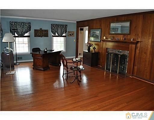 152 Mountainview Road Warren, NJ 07059 - Photo 4 of 10 a living room with furniture and a fireplace