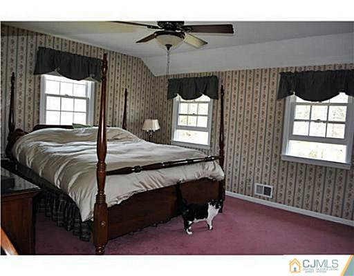 152 Mountainview Road Warren, NJ 07059 - Photo 9 of 10 a bedroom with a bed window and cabinet
