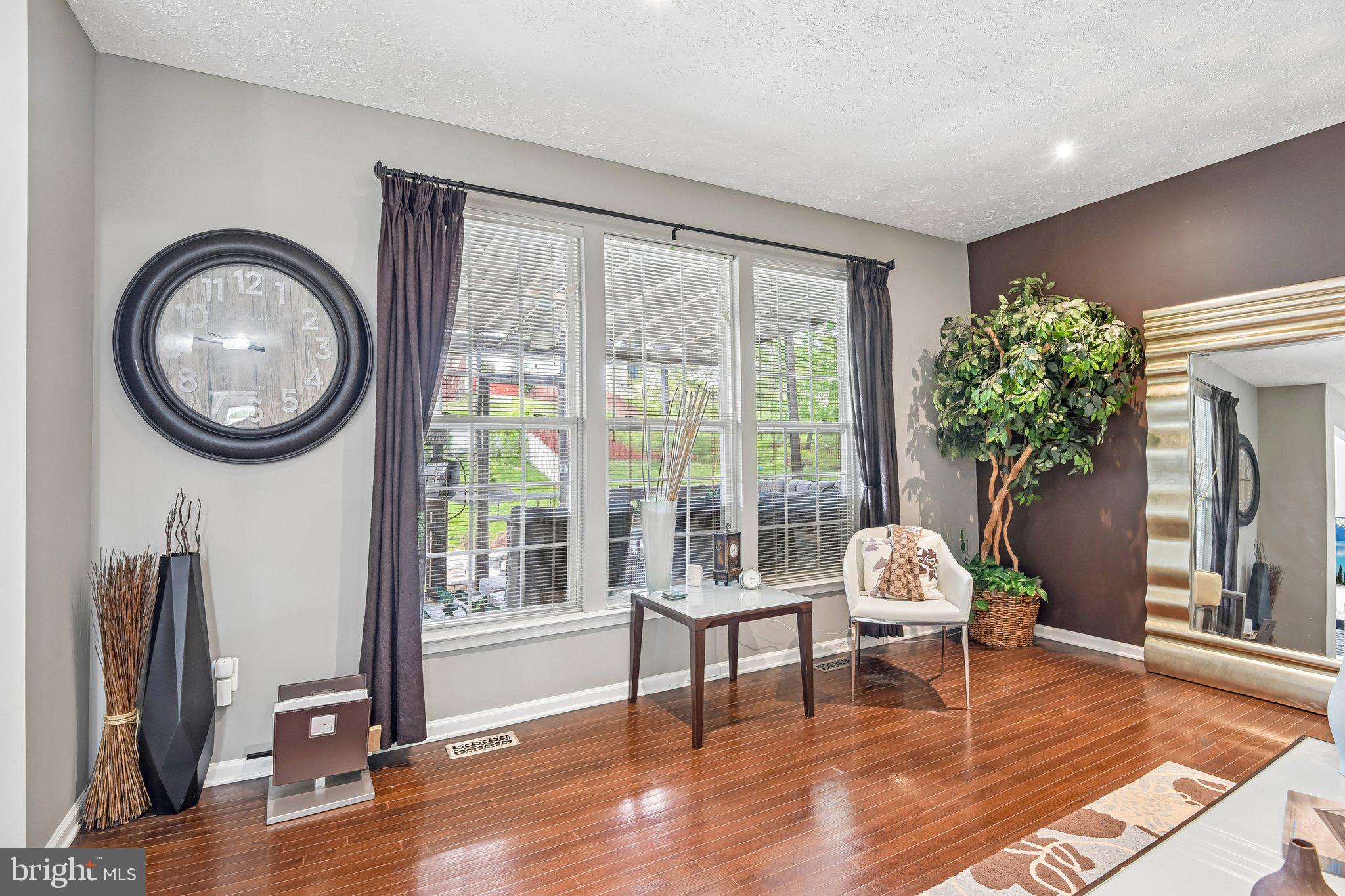 306 Watertons Way Joppa, MD 21085 - Photo 4 of 50 a living room with fireplace furniture and a large window