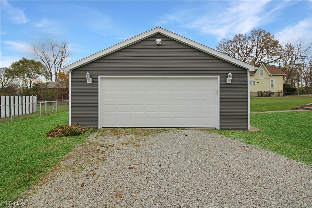 2148 Napoleon Road Fremont, OH 43420 - Photo 4 of 32 Garage with a lawn