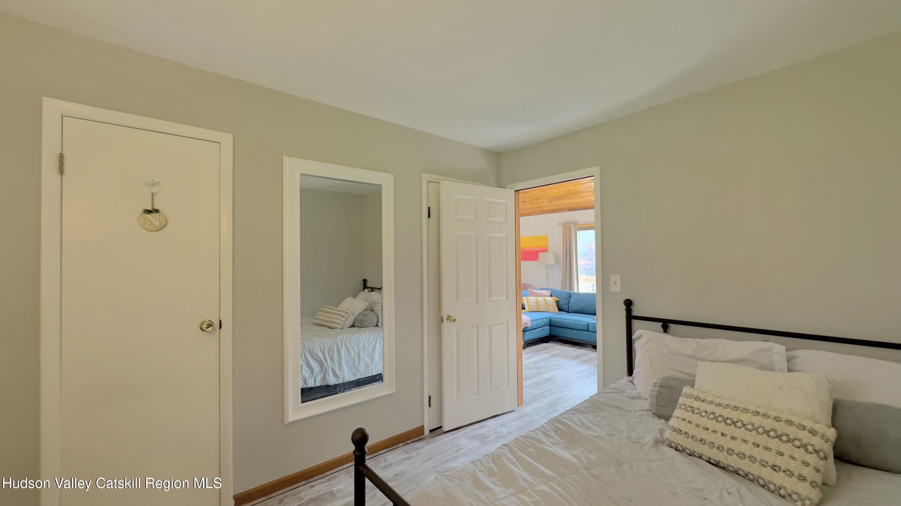 1542 Sleepy Hollow Road Athens, NY 12015 - Photo 11 of 27 a view of a bedroom with furniture and window