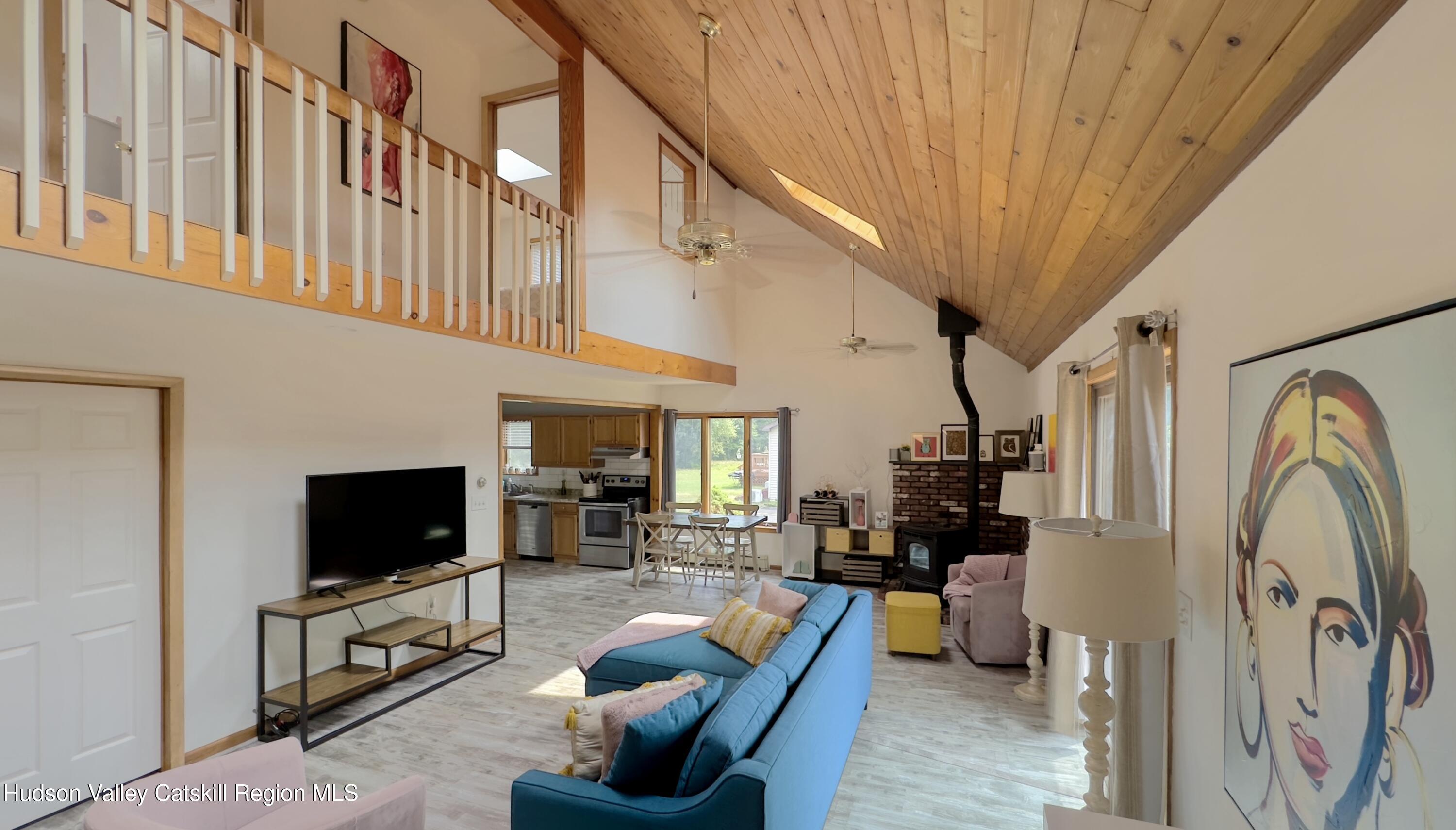 1542 Sleepy Hollow Road Athens, NY 12015 - Photo 2 of 27 a living room with furniture and a flat screen tv